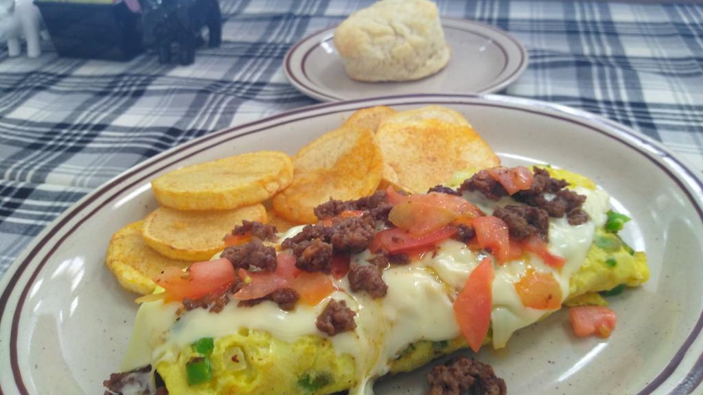 Bj'S Omelette · Ground beef, bell peppers, onions, tomatoes, and Swiss cheese.