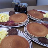 Family Feast · 8 eggs scrambled, 8 strips of bacon, 4 sausage patties, and 8 pancakes or 8 Triangles of Fre...
