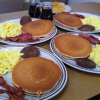 Jnj'S Family Feast · 8 eggs scrambled, 8 strips of bacon, 4 sausage patties, 4 hashbrowns, and 8 pancakes or 8 Tr...