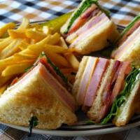 Bj'S Club Sandwich · Han, turkey, bacon, sliced tomatoes, lettuce, swiss cheese, American cheese, and mayo on you...