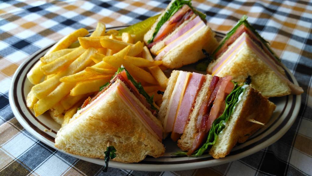 Bj'S Club Sandwich · Han, turkey, bacon, sliced tomatoes, lettuce, swiss cheese, American cheese, and mayo on your choice of white or wheat bread.