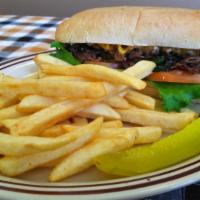 Philly Cheese Steak · Shredded steak, grilled poblano peppers, onion, lettuce, tomatoes, cheese, and mayo served o...