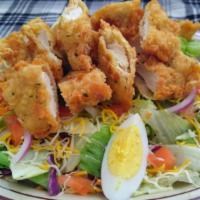 Chicken Tender Salad · Mix lettuce, crispy chicken, diced tomatoes, hard boiled egg, red onions and cheese.