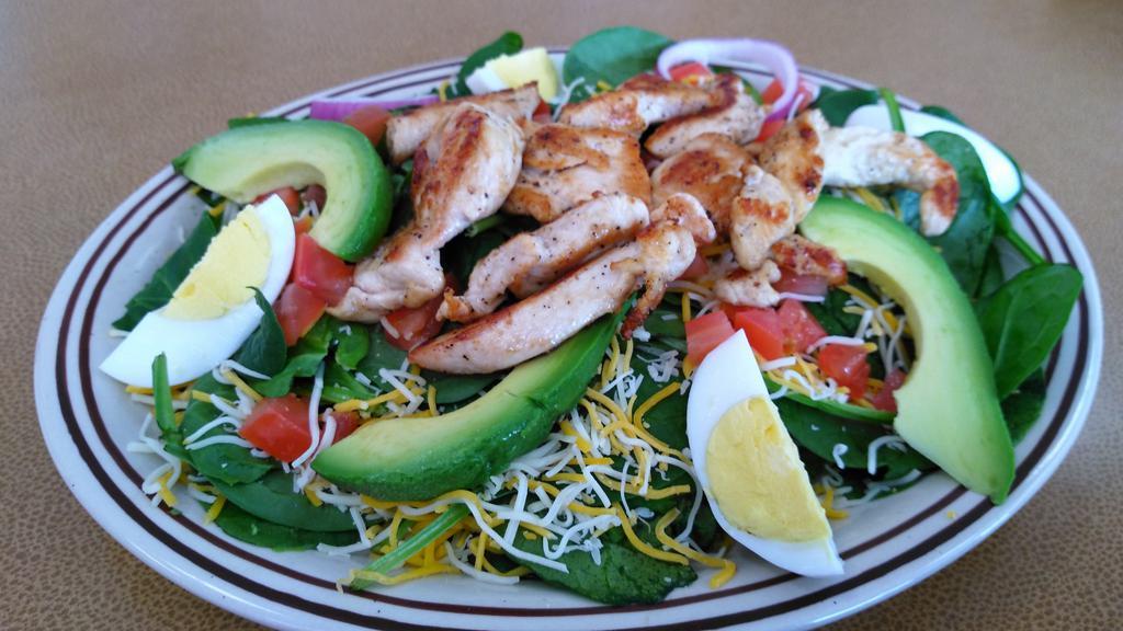 Jnj'S Spinach Salad · Spinach, grilled chicken, diced tomatoes, hard boiled egg, red onions and cheese.