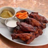 Chicken Wings · Jumbo smoked, crispy wings, Nashville hot sauce, pickled carrots, ranch dressing.