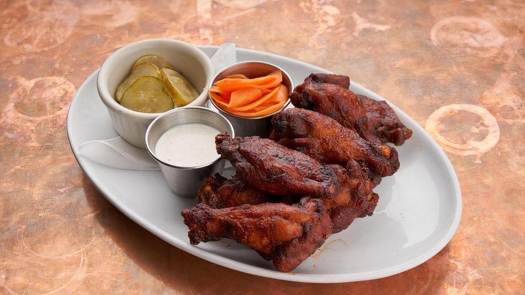 Chicken Wings · Jumbo smoked, crispy wings, Nashville hot sauce, pickled carrots, ranch dressing.