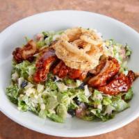 Rebel'S Hot Chicken Chopped Salad · Crispy chicken breast, hot cayenne pepper mop, romaine, iceberg, red leaf, tomatoes, cucumbe...