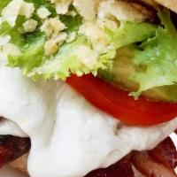 Tasty Burger · Arepa whit premium beef, caramelized onion, lettuce, tomato, bacon, ham, potato chips, mozza...