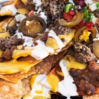 Nacho World · Fresh Corn Chips W/House Made Chili, House Made Queso, Impossible Crumble, Vegan Sour Cream,...
