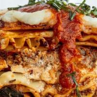 Impossible Cheesy Lasagna · Multi-layer lasagna with house made ricotta, mozzarella, & parmesan, stuffed with Italian se...