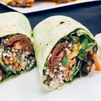 The Nola Bowla Wrap · Blackened Vegan Shrimp, Raw Spinach, Quinoa Salad, Organic Pear Tomatoes, Spicy Cream, & Wal...
