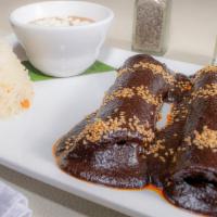 Lita'S Mole Enchilada · Two chicken enchiladas with mole sauce, served with Mexican slaw.