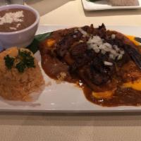 Enchilada Especiales · Two cheese enchiladas with chile con carne topped with beef or chicken fajitas + fresh onion...