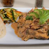 Lita'S Pollo Especial · Chicken breast topped with a cream sauce, sautéed poblanos, mushroom & onion with rice, vege...