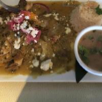Paradise Chicken · Chicken with mushrooms, peppers & onions on a spicy tomatillo sauce, served with rice + cup ...
