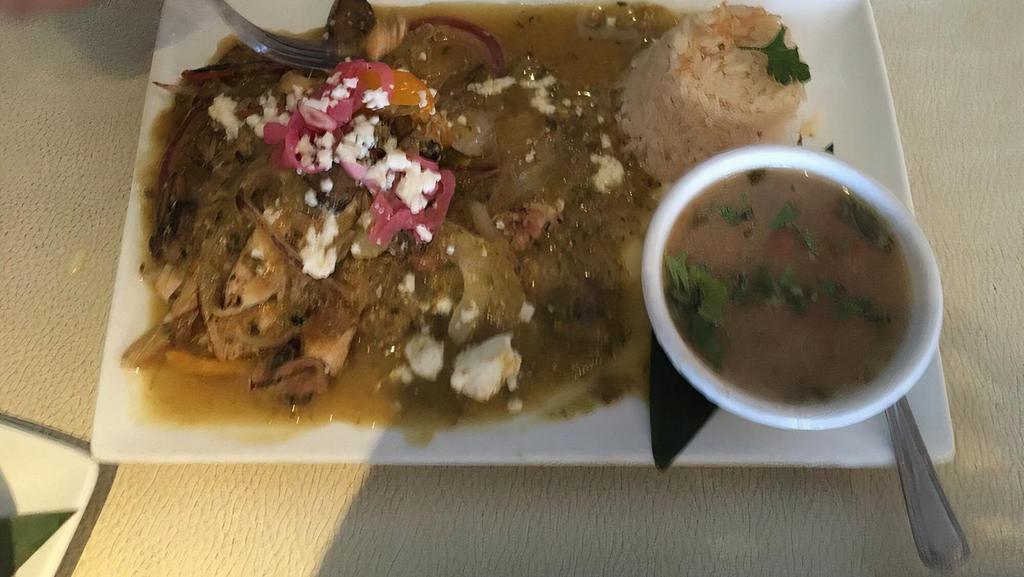 Paradise Chicken · Chicken with mushrooms, peppers & onions on a spicy tomatillo sauce, served with rice + cup of bean soup.
