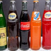 Coca Cola / Mexican Coke® · Coca Cola Mexicana, endulzada con caña./ Mexican Coke, sweetened with sugar cane.