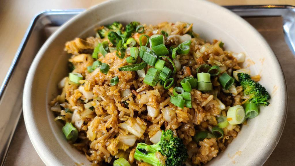 Basil Fried Rice · Basil sauce, Thai peppers, scallions, bell peppers, carrots, cabbage, fish sauce, & fresh basil.