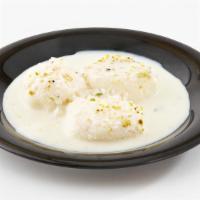 Ras Malai · Light, spongy, spiced softly with cardamon and delicate saffron, served cold in sweetened mi...