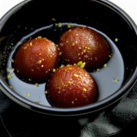 Gulab Jamun · Milk-based pastry balls with honey-flavored syrup.