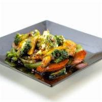 Wok Vegetables (Vg) · Wok tossed bell peppers, zucchini, carrots & broccoli in soy based sauce.