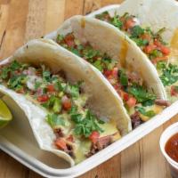 Taco Tray · Three Brisket tacos served on flour tortillas with brisket, queso, pico de gallo, cilantro, ...
