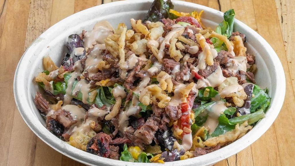 Brisket Love Salad · Mixed greens, roasted bell peppers, roasted corn, tomato, fried onion strings, and chopped brisket tossed with BBQ ranch
