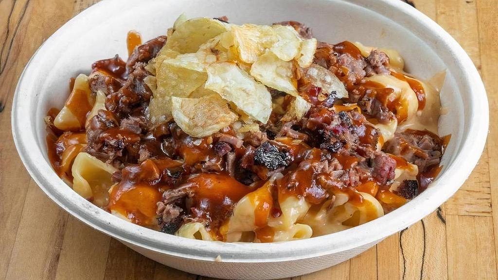 Loaded Mac N Cheese · Homemade pasta shells, Brisket Love four cheese sauce, chopped Brisket, BBQ sauce, kettle chips