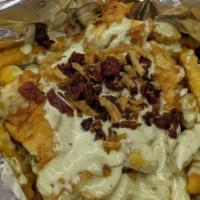 Ranch Fries · Crinkle cut fries, homemade ranch dressing, bacon bites, Monterey Jack cheese and garnish.
