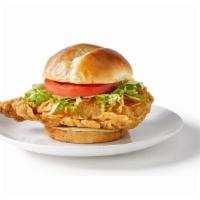 Crispy Chicken Sandwich · Our signature hand-breaded chicken breast tossed in your favorite sauce, topped with lettuce...
