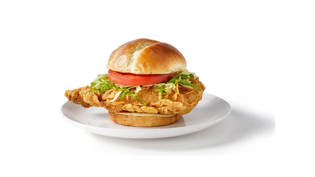 Crispy Chicken Sandwich · Our signature hand-breaded chicken breast tossed in your favorite sauce, topped with lettuce and tomato on a brioche bun.