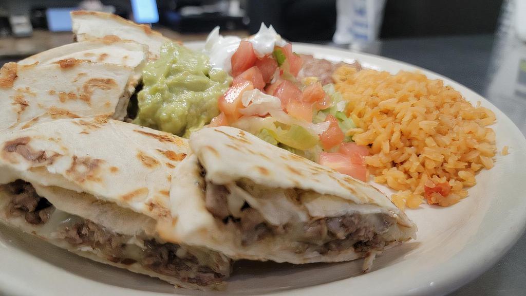 Asada Quesadilla · SERVED WITH RICE, REFRIED BEANS, GUACAMOLE, SOUR CREAM AND SALAD ON THE SIDE.