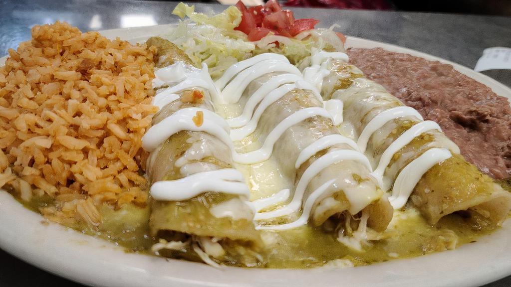 Enchiladas Verdes Plate · THREE CHICKEN ENCHILADAS ON CORN TORTILLAS, TOPPED WITH MONTERREY JACK CHEESE MELTED WITH TOMATILLO SAUCE. SERVED WITH RICE, REFRIED BEANS AND TWO TORTILLAS ON THE SIDE.