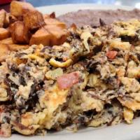 Machacado With Egg · MACHACADO MEAT MIXED WITH EGGS AND PICO DE GALLO, SERVED WITH BREAKFAST POTATOES, REFRIED BE...