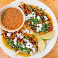 Pastor Taco · SERVED WITH GRILLED ONIONS AND BELL PEPPERS.