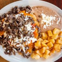 Chilaquiles With Asada · TORTILLA CHIPS WITH  SAUCE OF YOUR CHOICE, QUESO FRESCO, SOUR CREAM AND CARNE ASADA ON TOP, ...