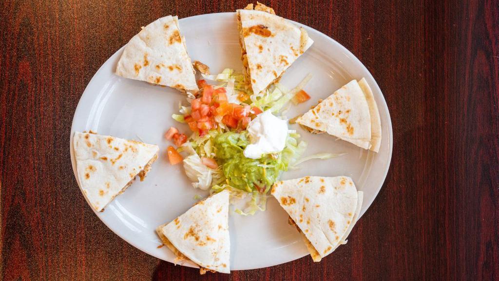 Chicken Fajita Quesadilla · SERVED WITH RICE, REFRIED BEANS, GUACAMOLE, SOUR CREAM AND SALAD ON THE SIDE.