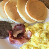 Pancake Breakfast · Four Pancakes with 2 of your choice of Bacon or Sausage (Pork or Turkey) and three Eggs eith...