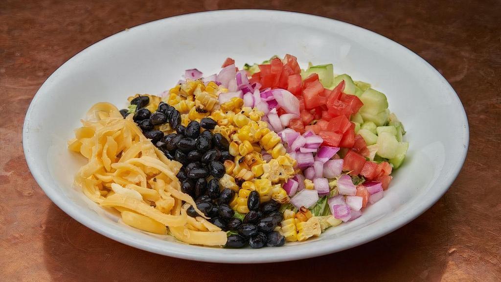 Southern Cobb Salad · Red leaf, romaine, iceberg, hardboiled egg, black beans, cucumbers, tomatoes, roasted corn, red onion, smoked cheddar, BBQ ranch..                  . Add smoked pulled chicken $4..                                                                              . Add smoked pulled pork shoulder $5.. Add grilled shrimp $6.