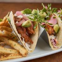 Bbq Pork Tacos · Hand-pulled and house-smoked pork shoulder, housemade BBQ sauce, classic slaw, pickled red o...