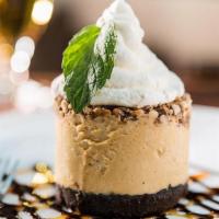 Peanut Butter Snickers Pie · Peanut butter mousse, Oreo cookie crust, Snickers pieces, whipped cream, chocolate and caram...