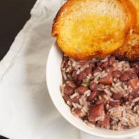 Red Beans & Rice · Slow cooked new orleans red beans, andouille sausage and rice.