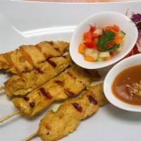 Chicken Satay · Skewer marinated chicken, served with side peanut sauce and cucumber - vinegar sauce.