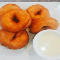Thai Donut · Deep fried round dough, served with a side of condensed milk.