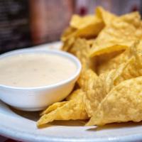 Chips N Queso · Tortilla chips, salsa, zesty queso.