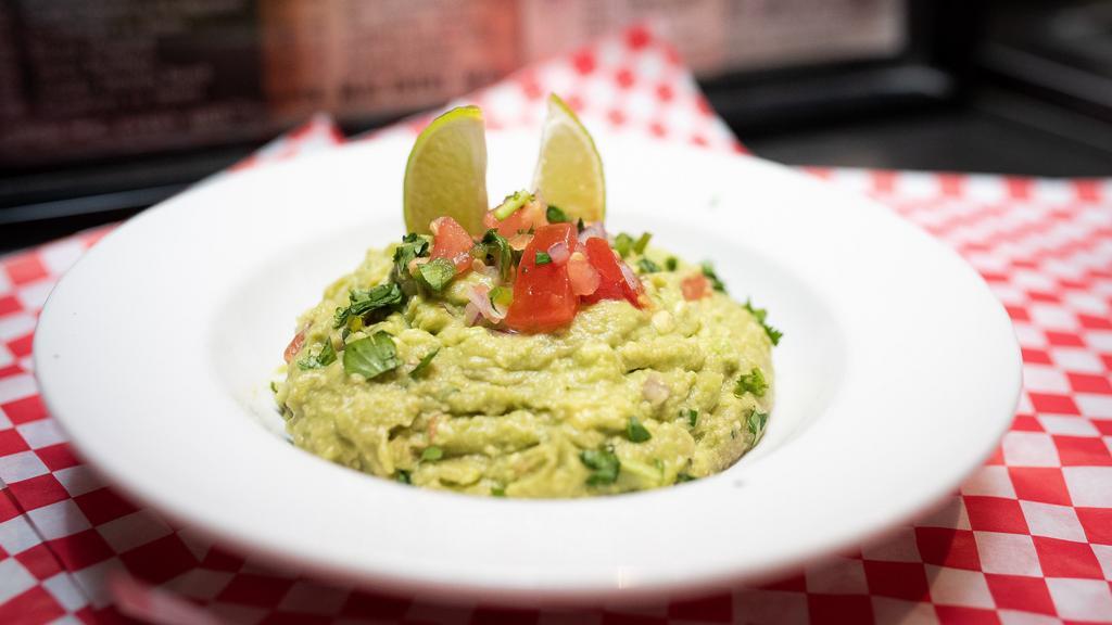 Guacamole Dip · Fresh guacamole served with chips n' salsa.