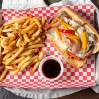 Texas Cheese Steak · Shaved beef, provolone cheese, peppers, onions and au jus dipping sauce.