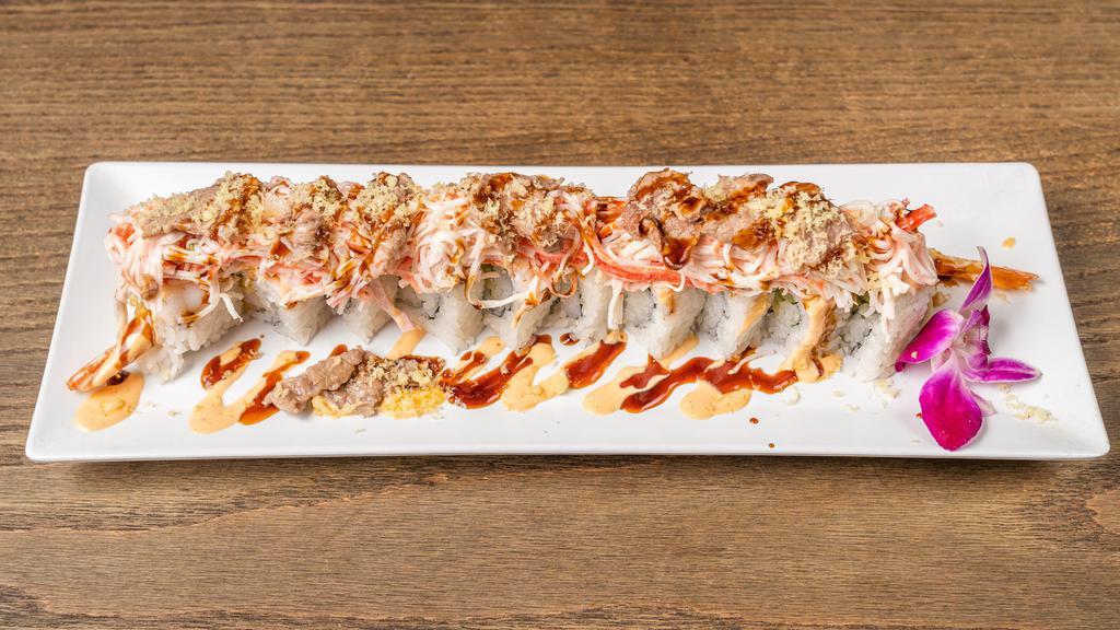 Land & Sea Roll · Shrimp tempura, cream cheese avocado, topped with boiled shrimp, crab salad thin sliced beef, eel sauce, spicy mayo and crunch.