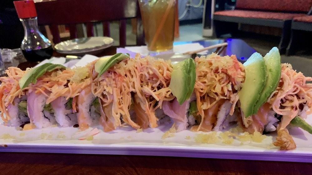 Andy Roll · Shrimp tempura, cream cheese, avocado topped tuna yellowtail, salmon, spicy mayo, eel sauce spicy crab and crunch and avocado slices.
