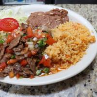 Bisteak A La Mexicana · Steak prepared mexican style with onions, tomato and jalapeños.